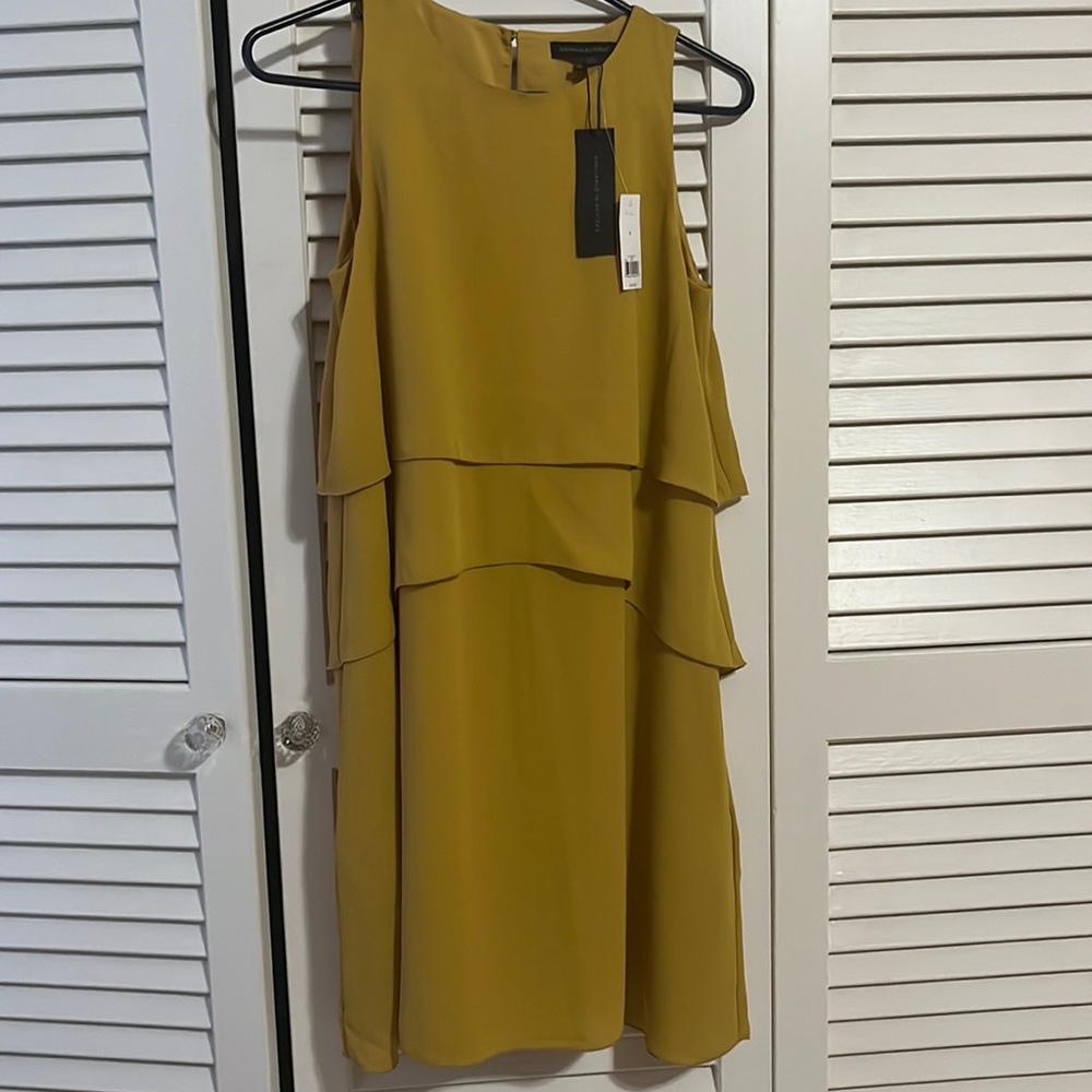 Mustard yellow colored New with tags Banana Republic dress with pockets